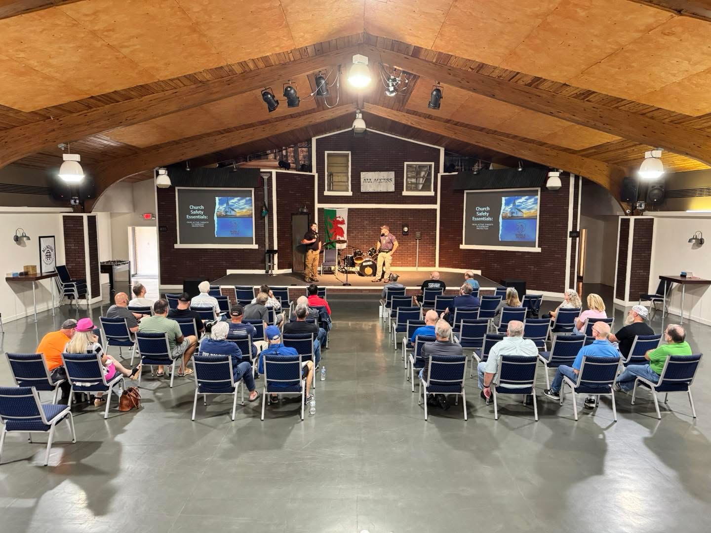 Church security training session with audience and presenters in church setting