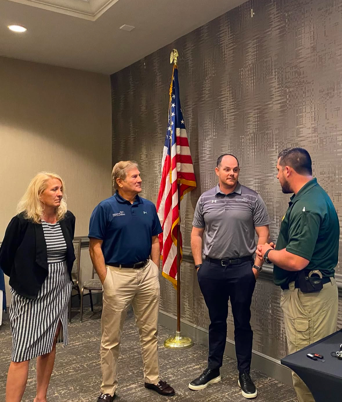 Professional recognition ceremony with law enforcement officials